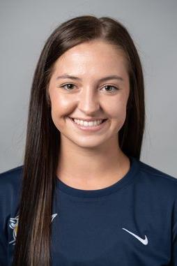 A portrait photograph of Morgan Pyles, smiling and facing the camera